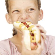 Girl eating hotdog with Parabens
