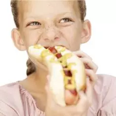 Girl eating hotdog with Parabens
