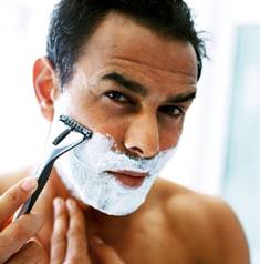 Man Shaving with Parabens Containing Foam